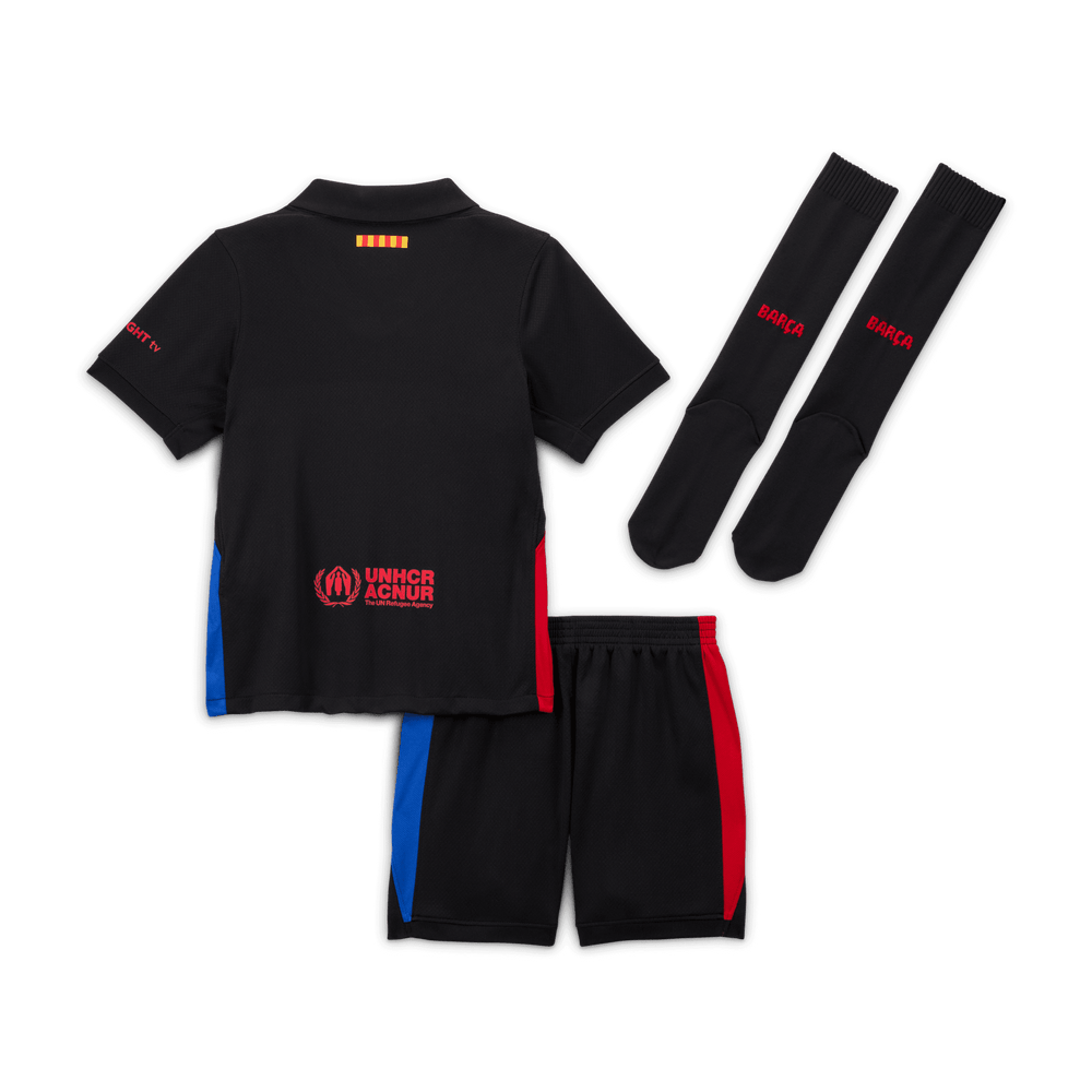 Puma Barcelona away kit 2024-25 kid featuring black polo shirt, shorts with blue and red accents, and matching black socks